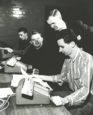 Ralph Stanton and students using the state-of-the-art Monroe Calculators