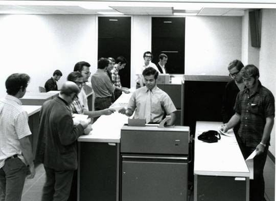 "wripper-wrappers" fed the cards into the IBM 7040