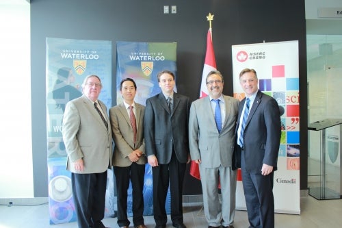Zongwei Chen and John Watrous with Vice-President George Dixon, Kitchener-Waterloo MP Peter Braid, President Hamdullapur