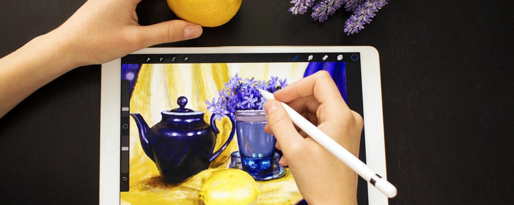 image showing a person creating art on a tablet