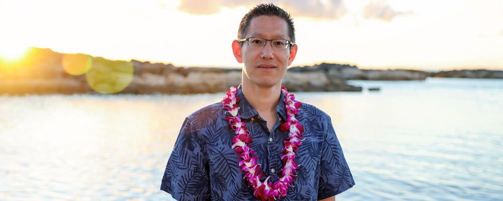 photo of Professor Jimmy Lin on a beach