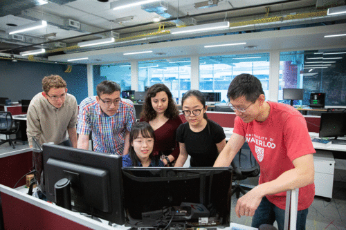 A group of students at a computer