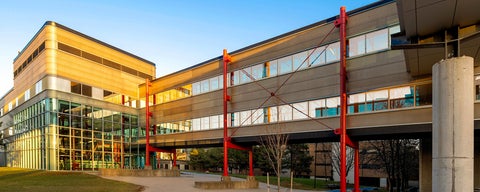 Davis Centre lit by warm light during sunset