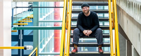 Zach McKendrick on stairs in Davis Centre