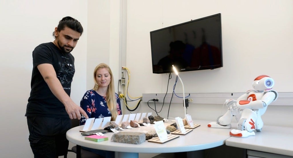 photo of Nalin Chhibbers, Jessy Ceha and NAO, an educational robot