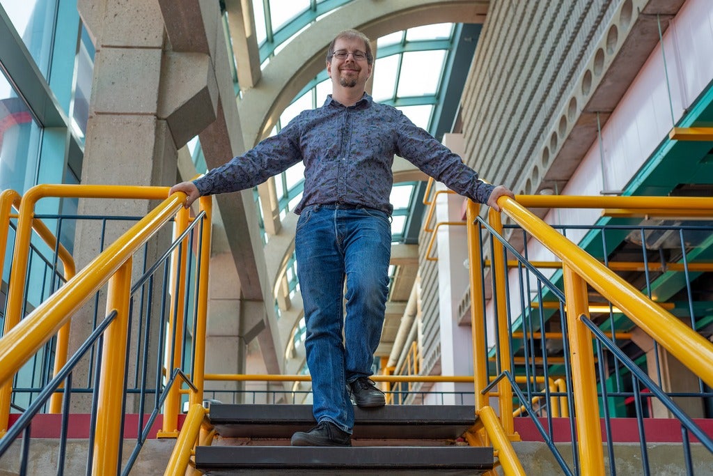 Professor Dan Brown on stairs in Waterloo's Davis Centre