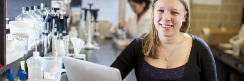 Undergraduate student Anna sitting at a computer